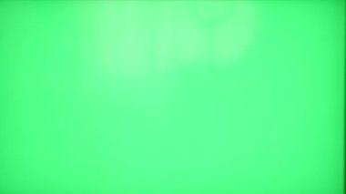 Transfer and transfer of money from hand to hand on a green background.
