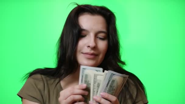 Beautiful Young Girl Having Fun Counts Dollar Bills Green Background — Video Stock