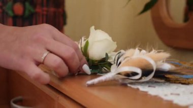The bride examines the wedding bouquet. The concept of preparation for the wedding.