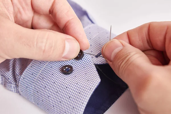 Man Manually Sews Button Sleeve His Shirt Self Service Small — Zdjęcie stockowe