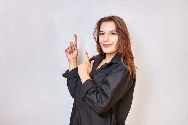 Beautiful Girl Black Shirt Shows Gesture Pointing Upwards Fingers Both — 图库照片