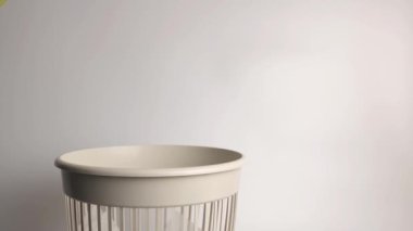 The egg carton was thrown into the trash for disposal and recycling