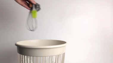 Kitchen items are thrown into the trash for disposal and recycling