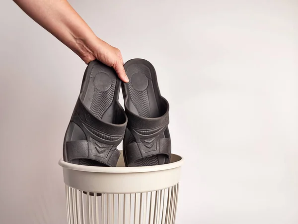 Bathroom slippers are thrown away for disposal and recycling