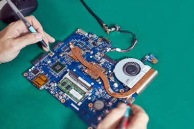 During repair of the motherboard, testing is carried out. Repair and maintenance of computers.