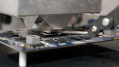 When repairing the motherboard, the chip is unsoldered. Repair and maintenance of computers.
