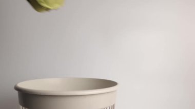 The egg carton was thrown into the trash for disposal and recycling