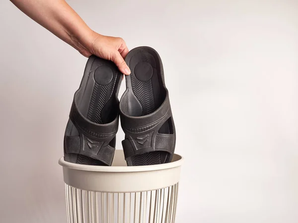 Bathroom slippers are thrown away for disposal and recycling