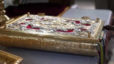 The Gospel lies on the throne during the church service.