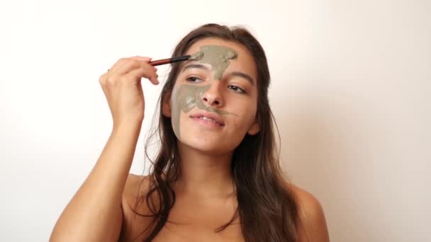 Girl Uses Blue Clay Face Care Beauty Concept Skin Care — Stockvideo