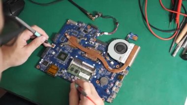 During repair of the motherboard, testing is carried out. Repair and maintenance of computers.