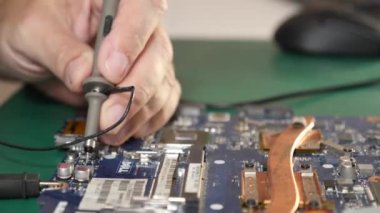 During repair of the motherboard, testing is carried out. Repair and maintenance of computers.