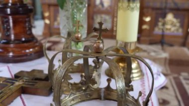 On the throne in the church are wreaths for the church wedding of the bride and groom. Wedding ceremony.