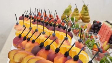 Fruit table. Grapes, pineapples, oranges, tangerines, etc. Buffet table design.