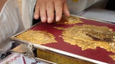 During a church wedding, the bride and groom make vows to each other and rely on the Gospel. Wedding ceremony.