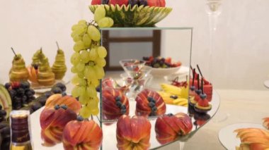 Fruit table. Grapes, pineapples, oranges, tangerines, etc. Buffet table design.
