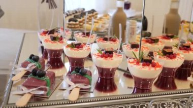 Sweet, buffet table with cakes, pies, cookies with glaze.