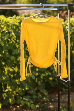 A beautiful stylish summer blouse on a hanger