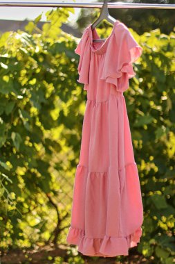 Stylish, fashionable summer dress on a hanger.