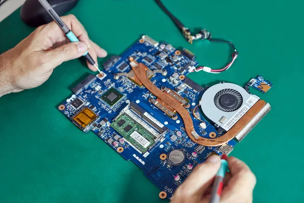 During repair of the motherboard, testing is carried out. Repair and maintenance of computers.