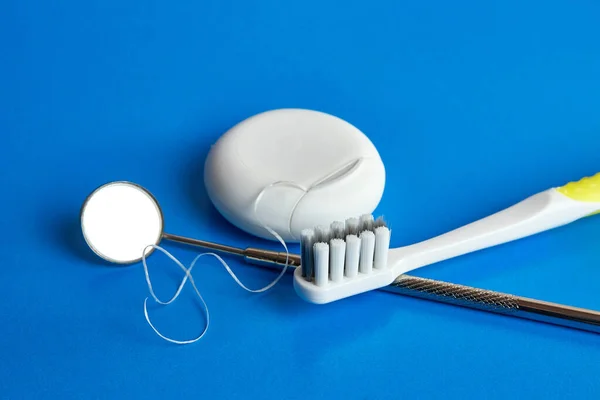 Dental Mirror Dental Floss Toothbrush Blue Background Dental Care — Stockfoto