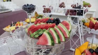 Fruit table. Grapes, pineapples, oranges, tangerines, etc. Buffet table design.