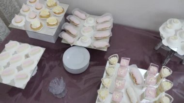 Sweet, buffet table with cakes, pies, cookies with glaze.