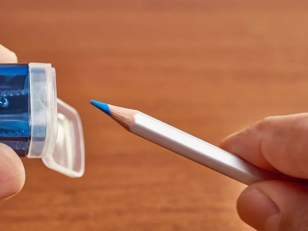 Sharpening pencils. Sharpener with container and pencil.