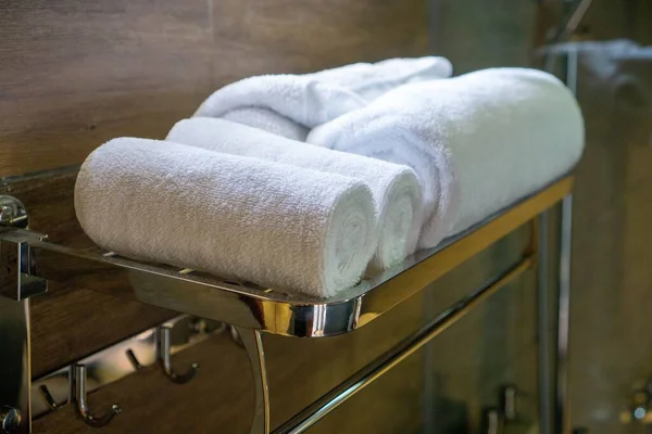 Close Up Photo of Large Bath Towels and Small Face Towels on a T