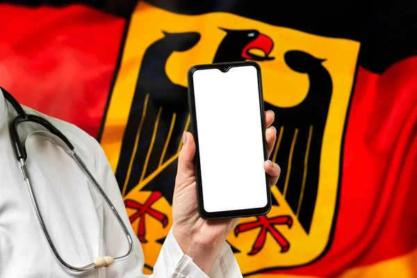 Nurse Holding Cell Phone Empty Screen German Flag — Stok fotoğraf