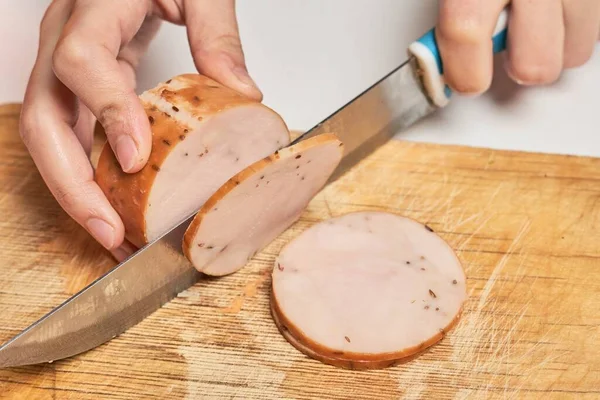 Woman Slicing Tasty Smoked Chicken Fillet — 스톡 사진