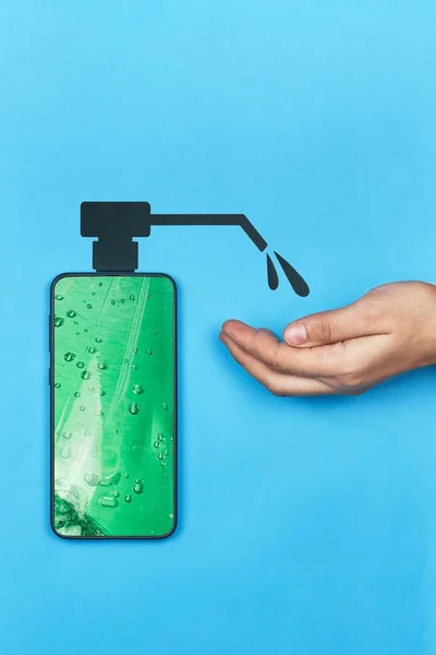 Woman disinfecting hand with mobile hand sanitizer