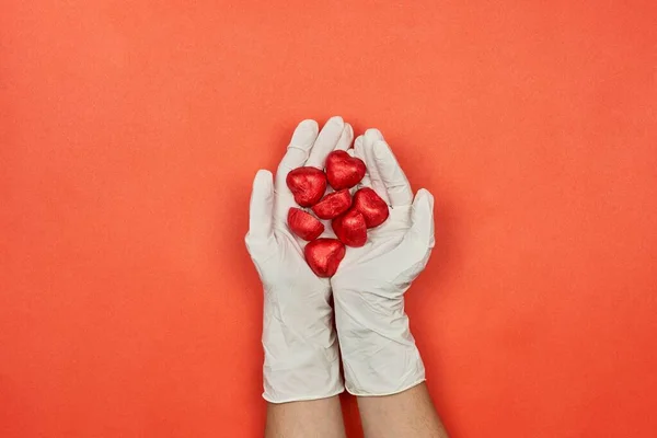 Female Doctor Medical Gloves Holds Hands Sweet Chocolate — Foto de Stock
