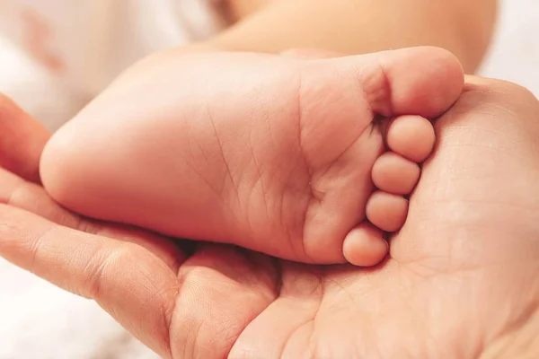Tiny Baby Feet Female Hand Closeup Mom Her Child — Stock Photo, Image