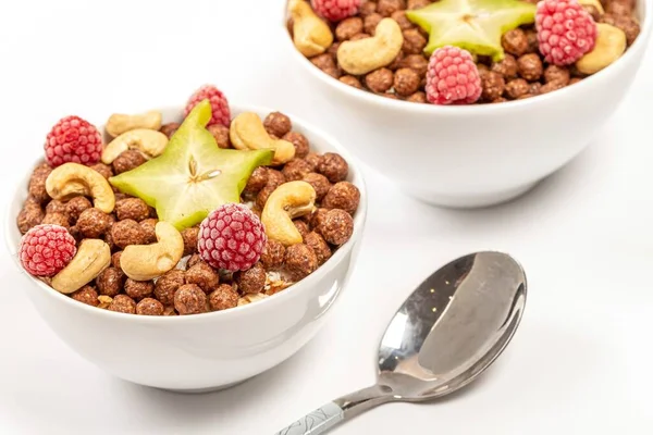 Delicious breakfast background with starfruit, almonds and raspb