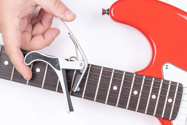 Electric Guitar with Capodastro in the hand