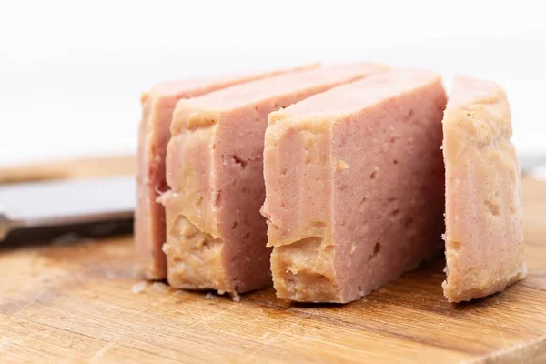 Luncheon Meat served on the wooden board