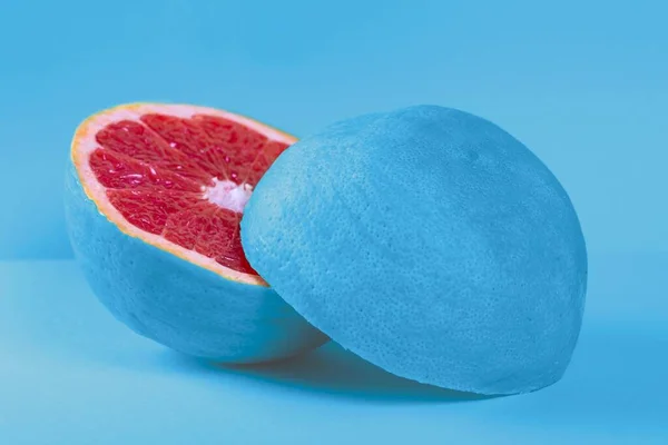 Fresh Grapefruit Halves Blue Peel Blue Background — Fotografia de Stock