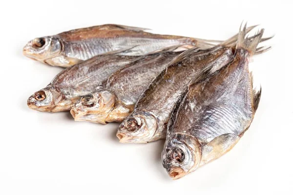 Dried salted roach on white background