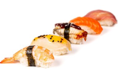 Assortment of nigiri with seafood on a white background