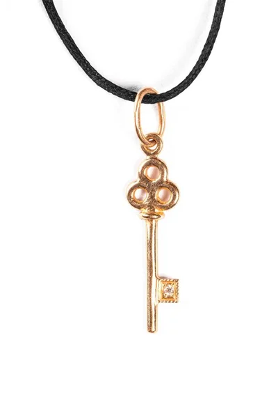 Pendant gold key with black cord