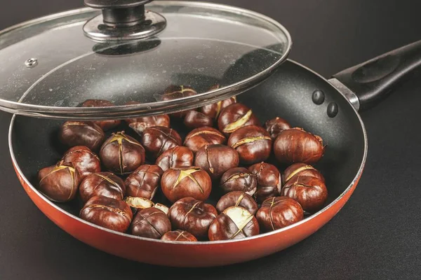 Frying pan with fried chestnuts
