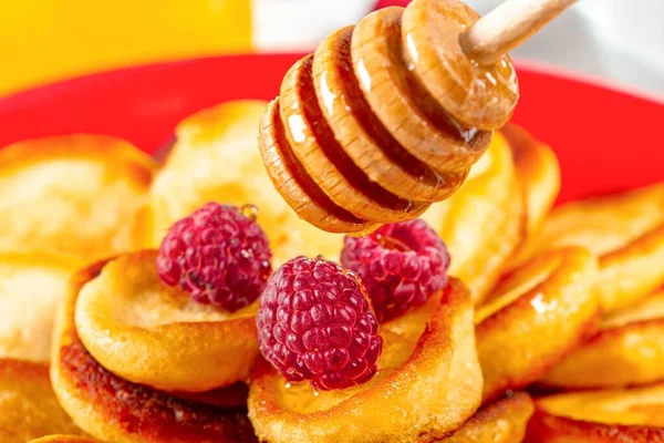Close-up, pancakes pour with honey