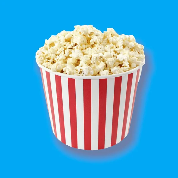 LIFESTYLE. POPCORN. IT\'S TIME FOR A MOVIE AT THE CINEMA. DIVERSIFIED COLORED BACKGROUND.