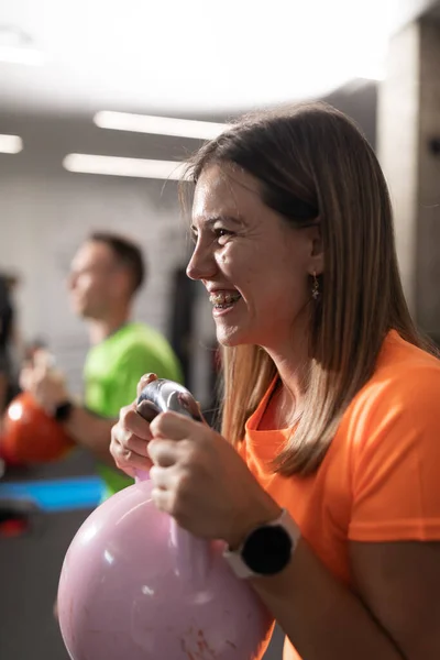 Young Woman Braces Smiles While Doing Sport Exercises Holding Kettlebell — Foto de Stock