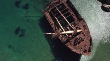 Aerial drone video of famous shipwreck of Olympia abandoned in Liverio bay near Kalotaritissa village, Cyclades islands, Greece