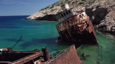 Aerial drone video of famous shipwreck of Olympia abandoned in Liverio bay near Kalotaritissa village, Cyclades islands, Greece