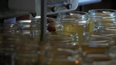 close up of honey pots in a laboratory