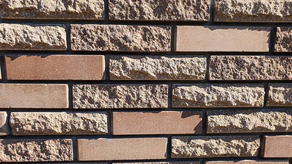 Mauerwerk an Wand und Boden. Verschiedene Steinstrukturen. Vielfarbiger Hintergrund. — Stockfoto