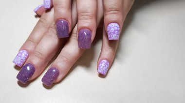 Acrylic nail extension, manicure, nail correction, hands in the foreground. copy space